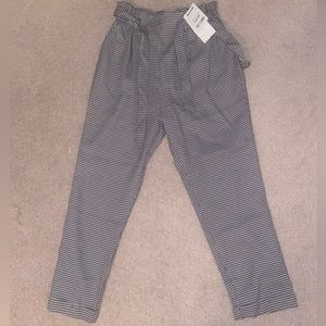 NEVER WORN: black and white plaid pants with belt.